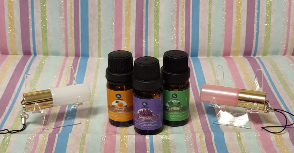 Photo of rollerball containers and some essential oils