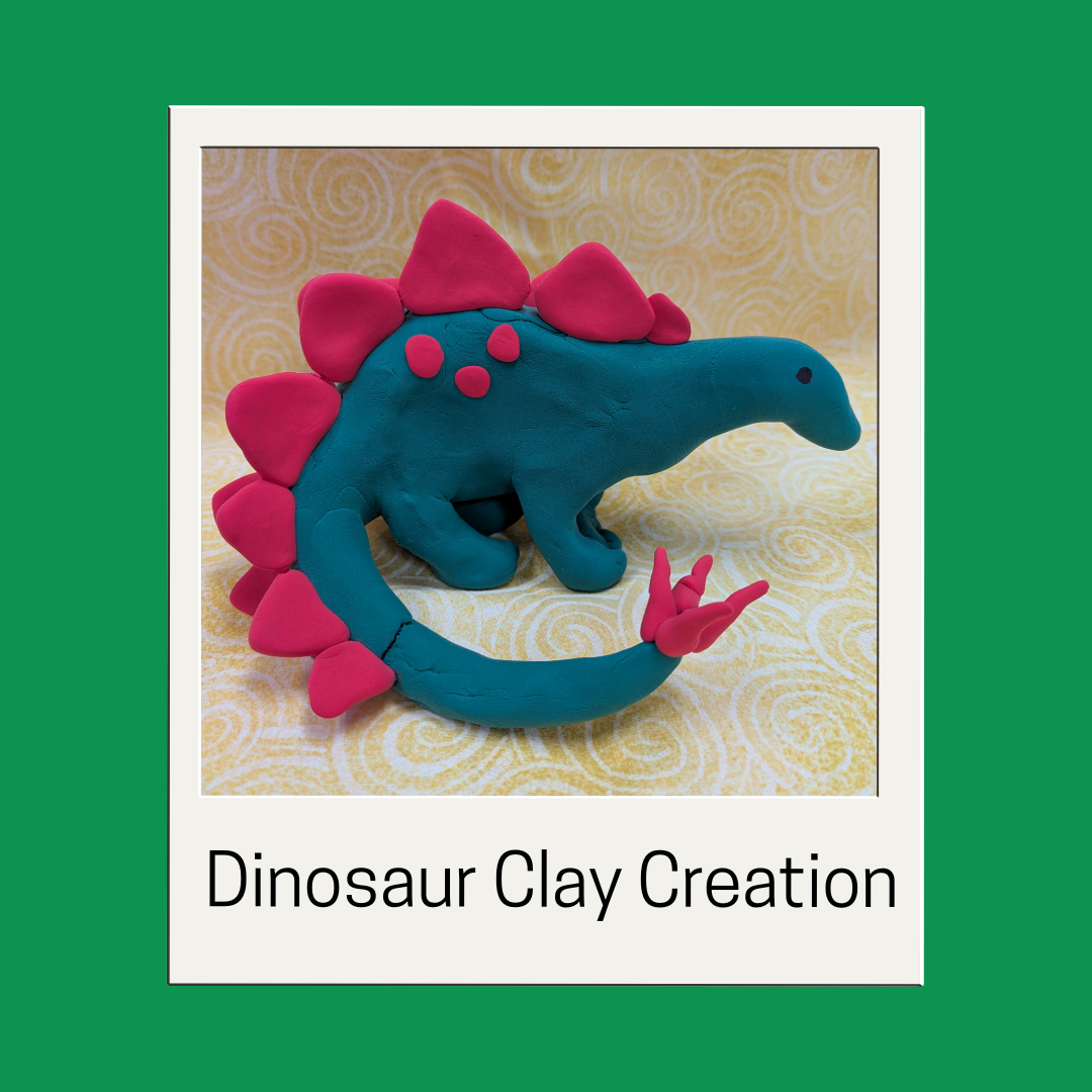 clay stegosaurus on a green background