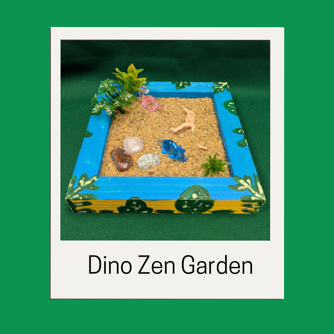 Dinosaur themed zen garden with tiny dinosaurs and fossils