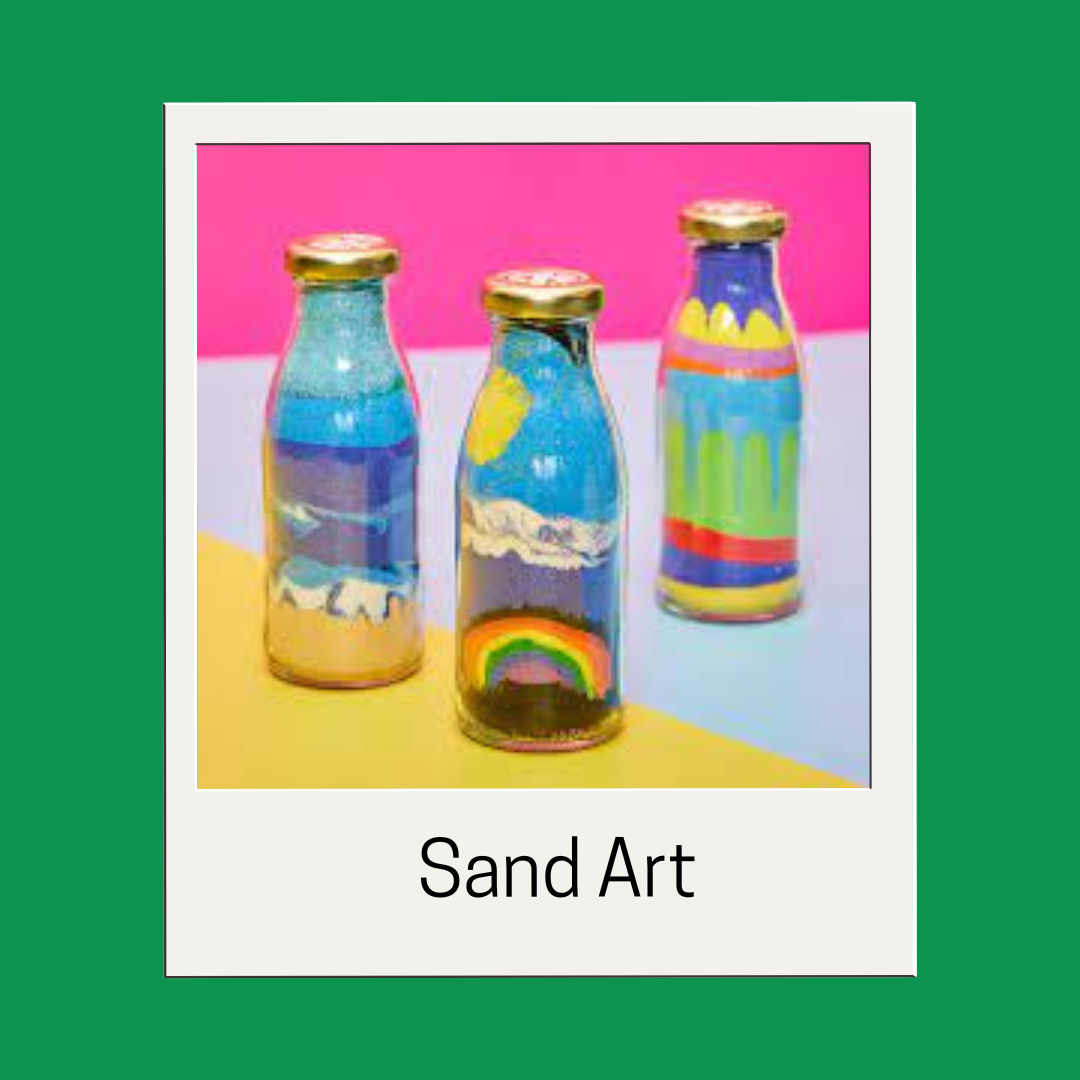 Picture of three sand art bottles on a green background